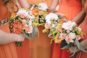 Bridal Party flowers in bright oranges