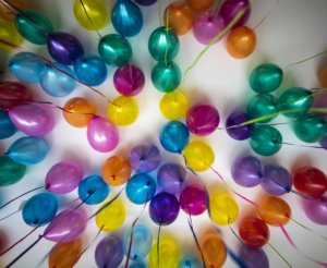 party space decorated with balloons for a milestone celebration