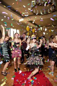 party guests dance under confetti at a bat mitzvah party