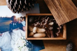 Photograph of a wedding couple on a table with other decorative memory box items