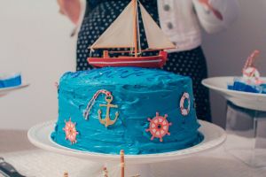 Bright blue, nautical themed cake at a summer baby shower