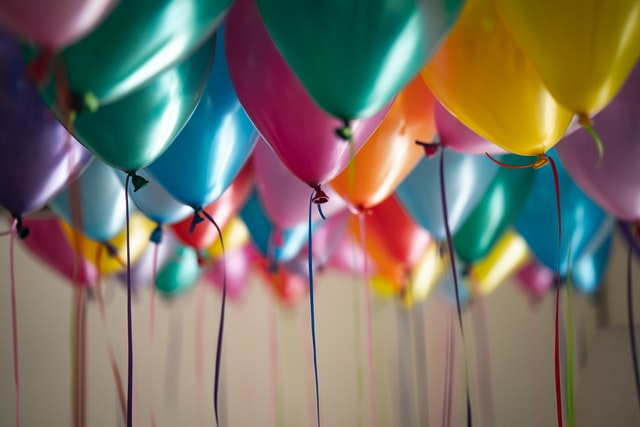 Colorful balloons hanging from the ceiling