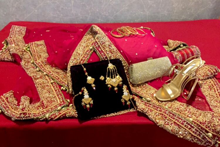 Red and gold wedding jewelry and shoes for a South Asian wedding at PineCrest.