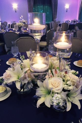 Close up of a candle centerpiece in the PineCrest ballroom, decorated for a special occasion