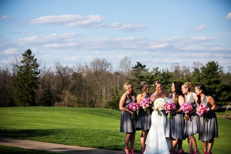 Bridal party of five standing on PineCrest's golf course near Bucks County.