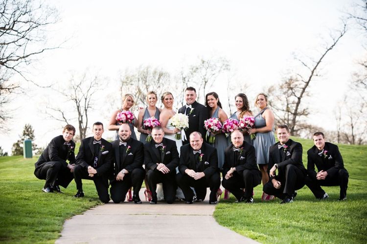 Large wedding party posing for pictures on PineCrest's golf course in Montgomery County, PA