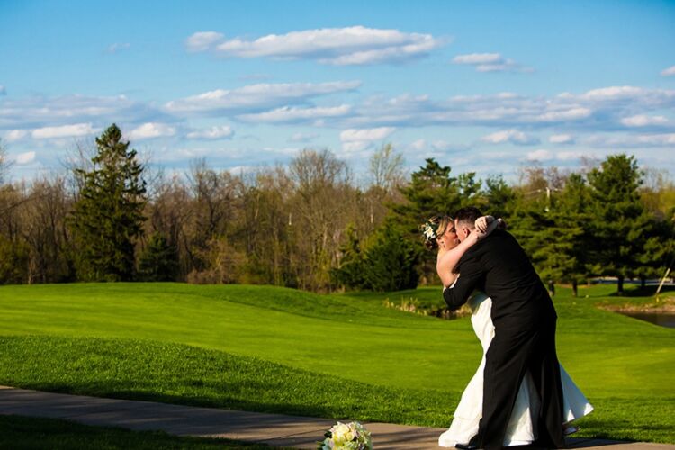 PineCrest wedding couple taking pictures on the golf course, a spectacular view from all wedding reception event spaces.
