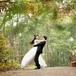 outdoor wedding photo on path surrounded by trees