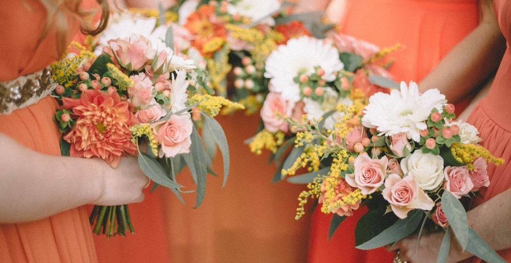 Bridal Party flowers in bright oranges