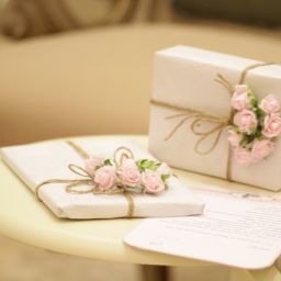 2 white boxes with pink flowers