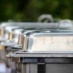 several chafing dishes lined up for a wedding buffet