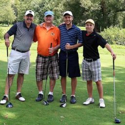 group of 4 golfers on golf course