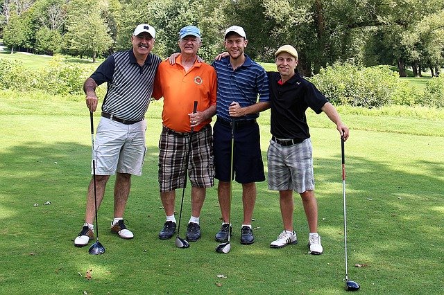 group of 4 golfers on golf course