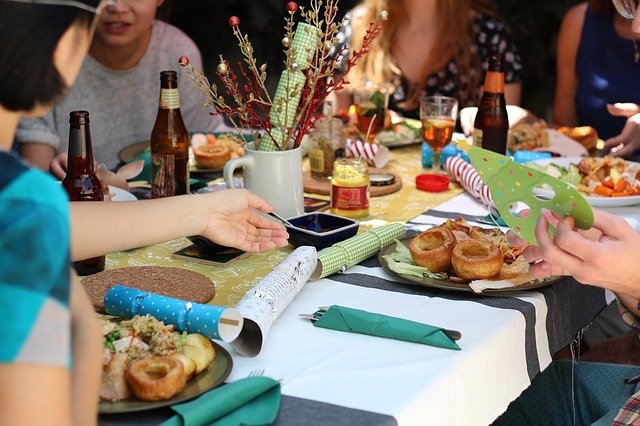 Friends at dinner party with decorations on the table