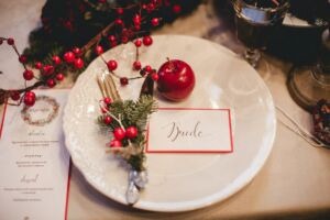 christmas themed wedding table decor with card saying bride