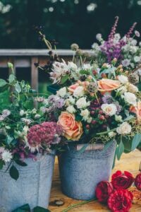 Wildflower bouquet in a metal bucket for wedding decoration