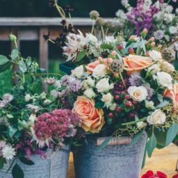 Wildflower bouquet in a metal bucket for wedding decoration
