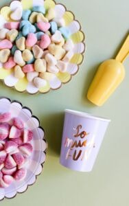 Candy station with purple cup to fill with candy