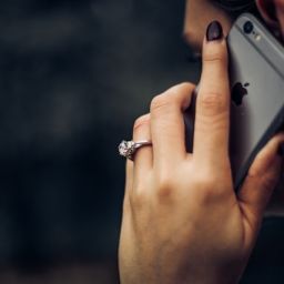 Woman wearing an engagement ring while on the phone