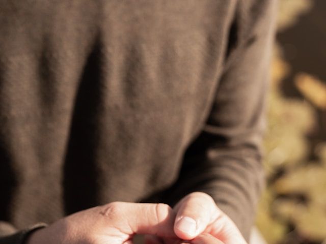 A man holding a women’s hand with a ring after proposing